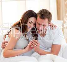 Joyful couple finding out results of a pregnancy test