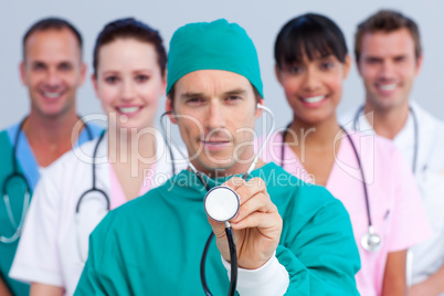 Charismatic surgeon and his medical team