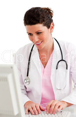 Female doctor working at a computer