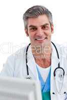Portrait of a male doctor holding a stethoscope