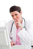 Smiling female doctor working at a computer