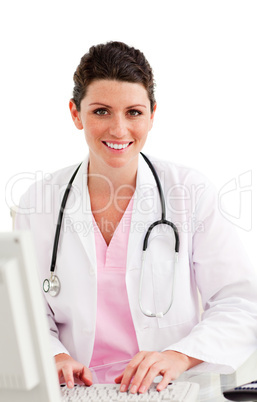 Charming female doctor working at a computer