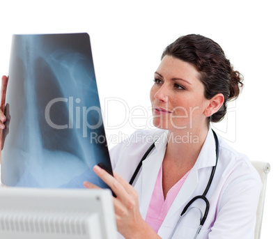 Female doctor looking at X-ray