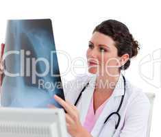 Female doctor looking at X-ray