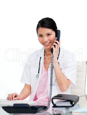 Asian doctor talking on phone