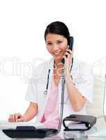 Asian doctor talking on phone