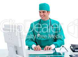 Smiling doctor working at a computer