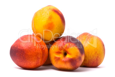 Juicy nectarines on a white background