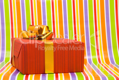 Gift box on a stripe background