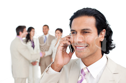 Portrait of latin businessman on phone with his team