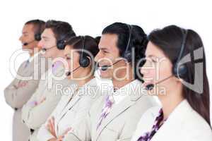 Confident business team lining up with headset on