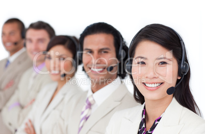 Enthusiastic business team lining up with headset on