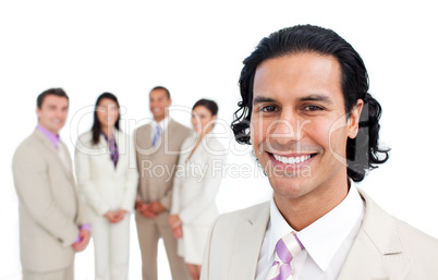 Portrait of latin businessman smiling with his team