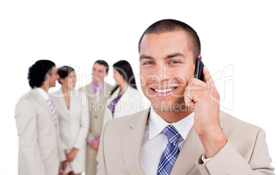Portrait of caucasian businessman on phone with his team
