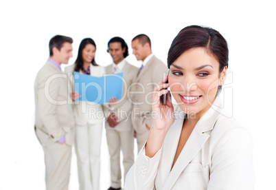 Portrait of an elegant businesswoman on phone with her team