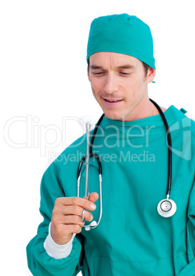 Portrait of a serious surgeon holding surgical forceps