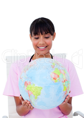 Portrait of a beautiful female doctor holding a terrestrial glob
