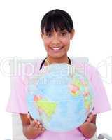 Portrait of an ethnic female doctor holding a terrestrial globe