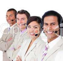 Smiling business team lining up with headset on