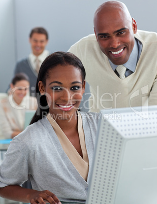 Portrait of two businesspeople working at a computer