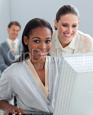 Portrait of two businesswomen working at a computer