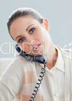 Serious businesswoman talking on phone