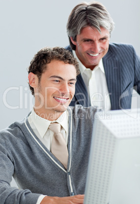 Portrait of two business colleagues working at a computer