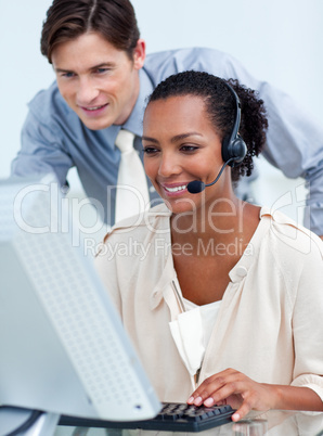 Charming business people working at a computer