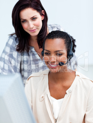 Confident business partners working at a computer