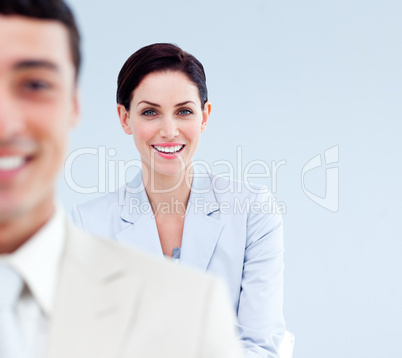 Smiling business people standing in a line