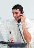 Smiling businessman talking on phone