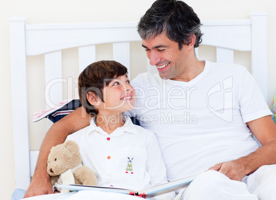 Attentive father reading with his son