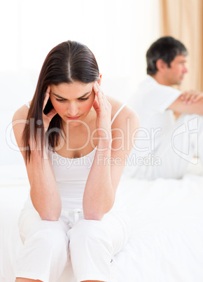 Distress couple sitting sitting separately after having a row