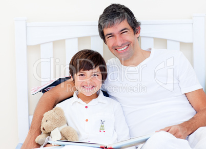 Happy father reading with his son