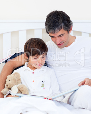 Caring father reading with his son