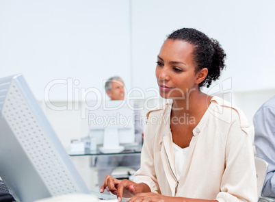 Concentrated businesswoman working at a computer