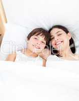 Smiling mother and her son lying