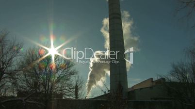 HD Panorama of coal burning power station with trees on foreground