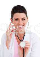 Happy female doctor holding a stethoscope