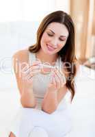 Smiling woman finding out results of a pregancy test