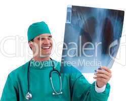 Enthusiastic surgeon looking at X-ray in his office