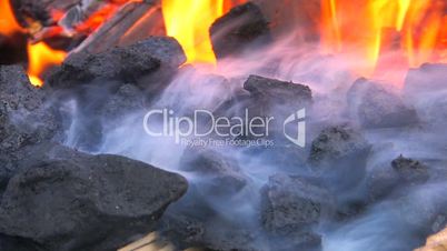 HD Hot coals burning in a portable forge