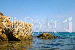 Coast of sea with stones in water