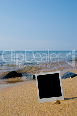 Photo card on sand beach.