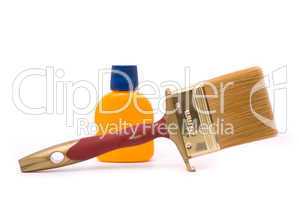 Professional paintbrush and yellow paint isolated on white backg