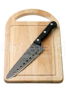 Kitchen knife on a breadboard