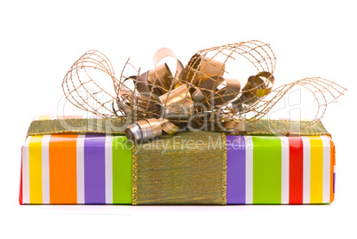 Gift box with golden bow on a white background