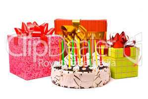 Pie with twelve candles and gifts in boxes on a white background