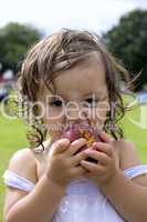 Baby girl eating an apple 1