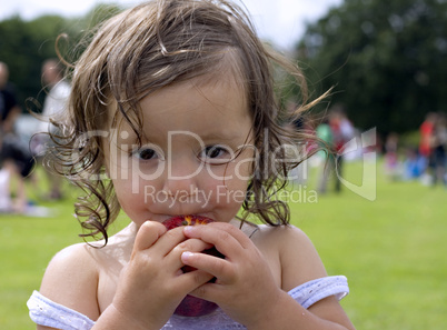 Baby girl eating an apple 3